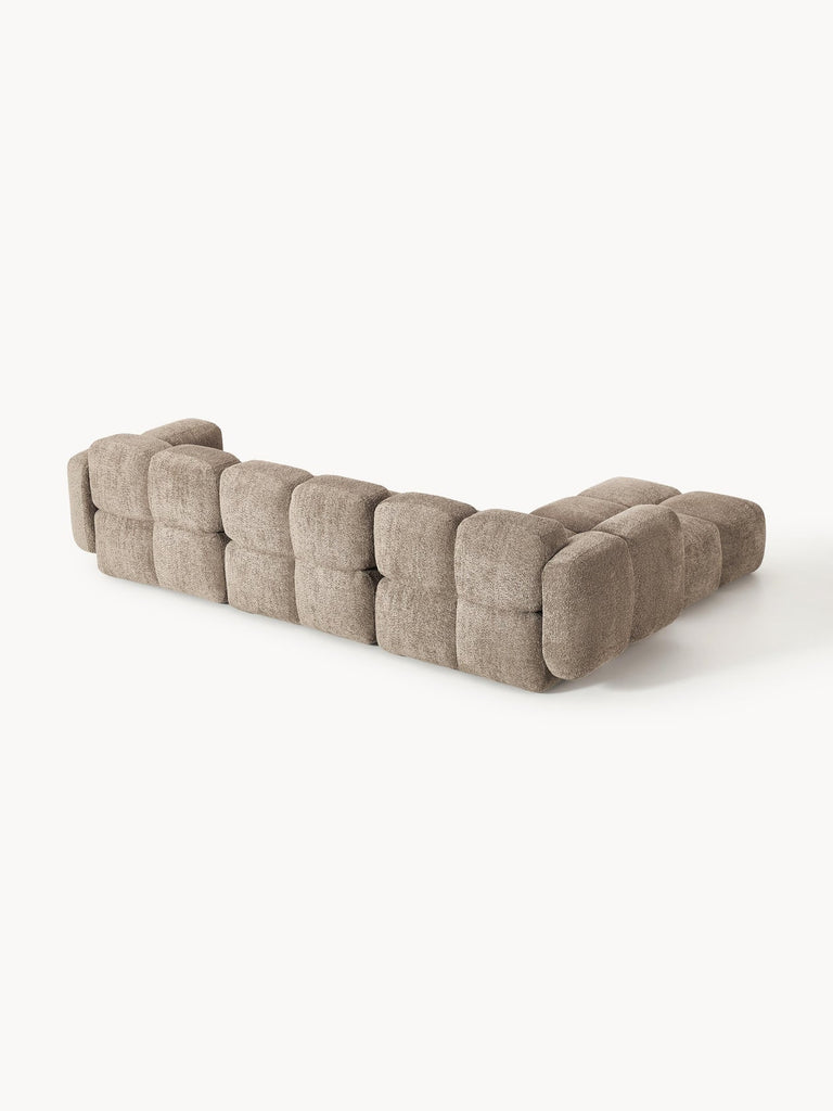 Canapé modulable 4 places en peluche-bouclette avec pouf Tayla