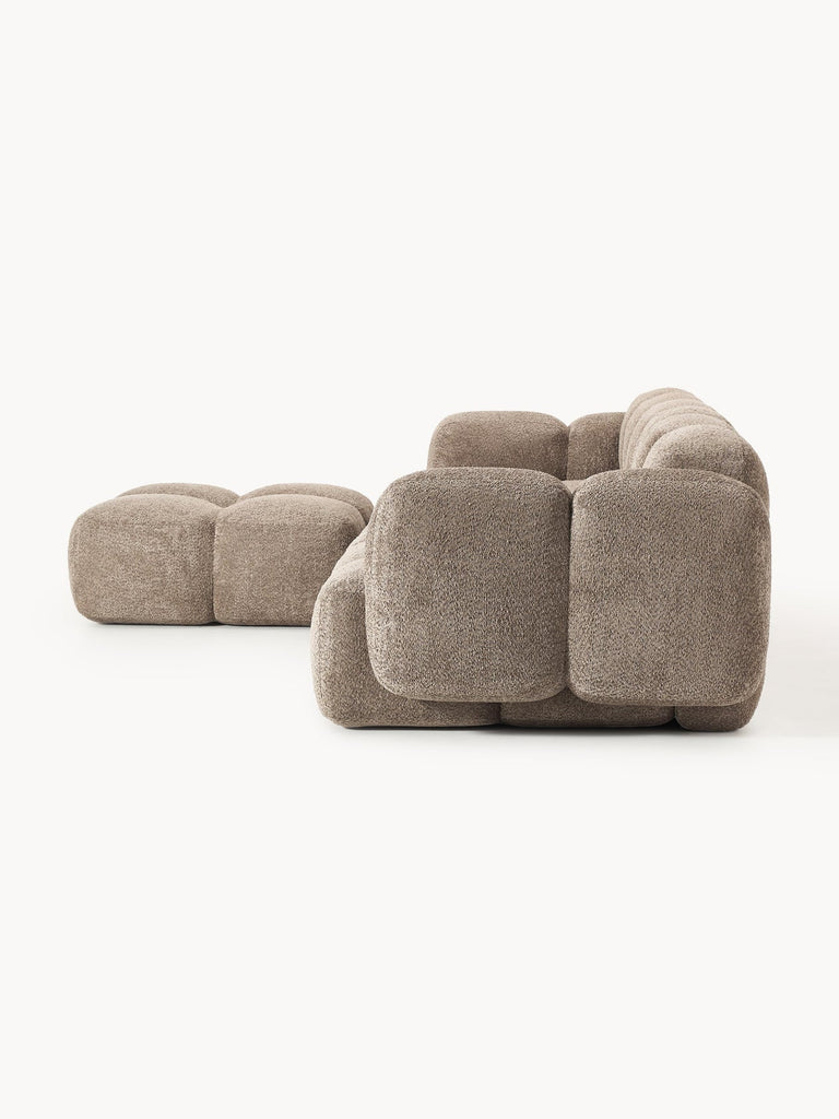 Canapé modulable 4 places en peluche-bouclette avec pouf Tayla