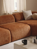 Canapé d'angle modulable 4 places en peluche-bouclette Wolke