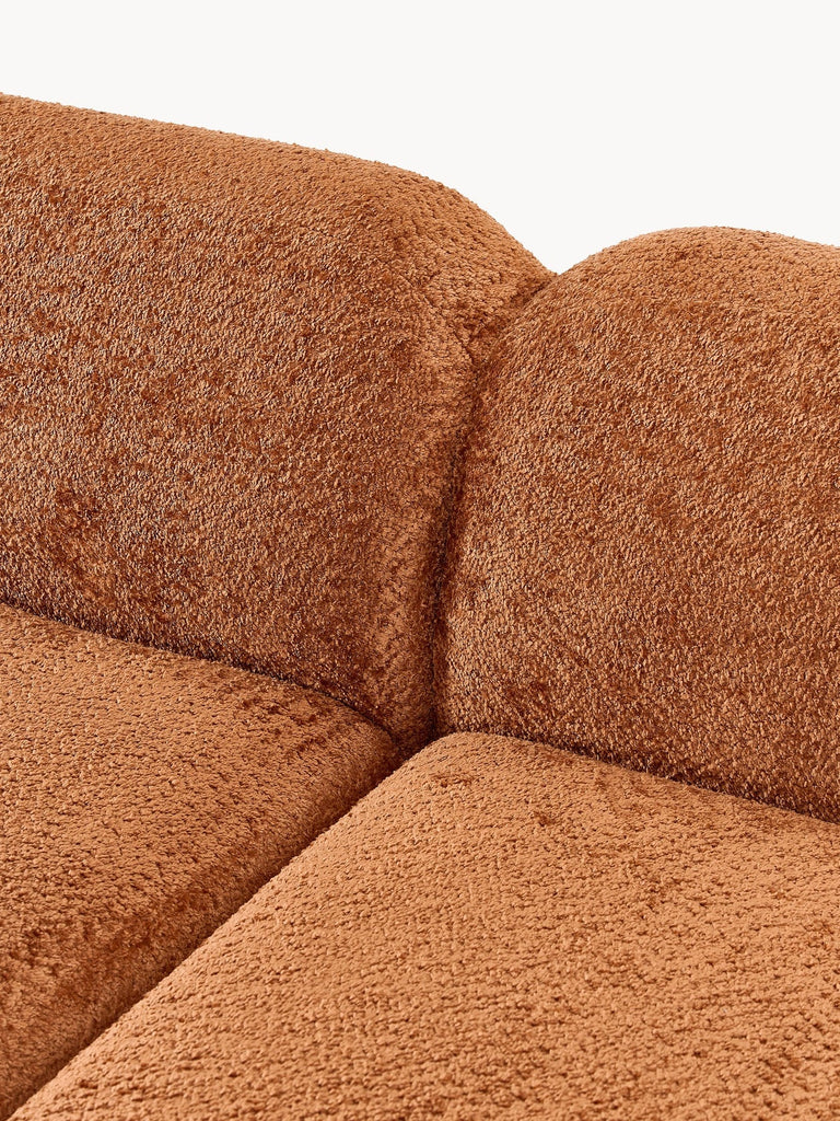 Canapé d'angle modulable 4 places en peluche-bouclette Wolke